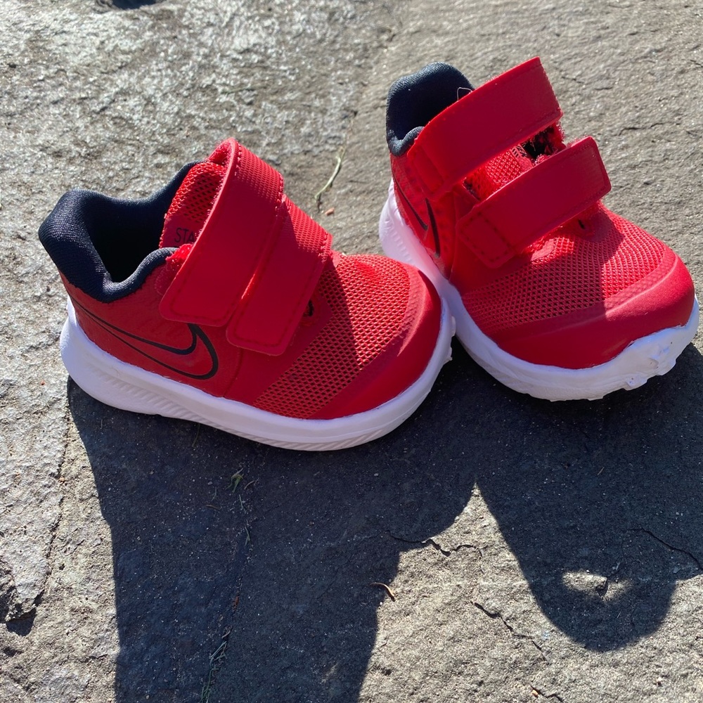 Nike Toddler Star Runner, red and black. Size 2C. Velcro straps.
